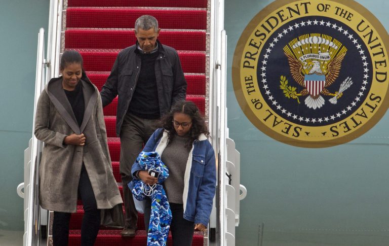 President Barack Obama accompanied by first lady Michelle Obama and his daughter Sasha, steps off from Air Force One upon their arrival at Andrews Air Force Base, Md., Monday, Jan. 2, 2017. The President and his family are returning from vacation in Hawaii. ( AP Photo/Jose Luis Magana)
