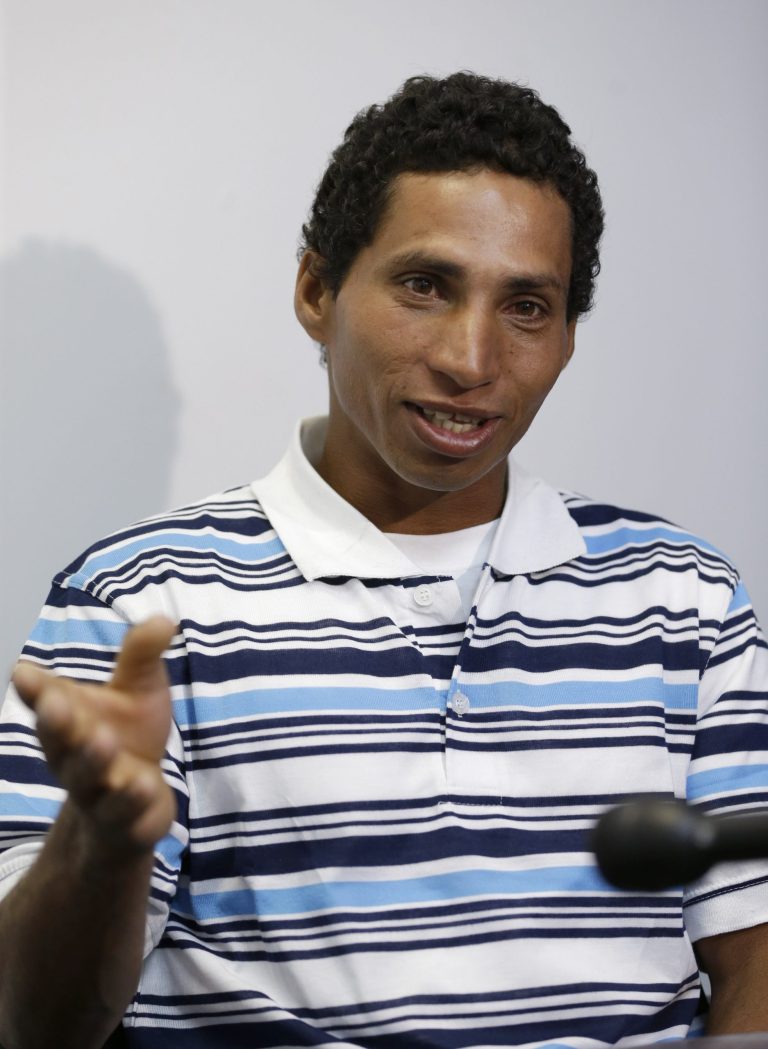 Yennier Martinez Diaz, 32, gestures as he recounts his voyage with eight other men aboard a homemade boat from Cuba to Key Biscayne, Fla., Wednesday, Sept. 24, 2014, during an interview with the Associated Press in Doral, Fla. Martinez Diaz described the 10 days at sea as 