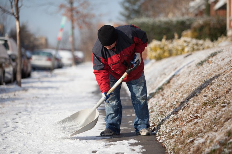 A man shovels snow away from the sidewalk in Washington D.C. this morning. D.C. got just over 1 inch of snow over Wednesday night, Thursday, Jan. 24, 2013. (Photo: Graeme Jennings/Washington Examiner)