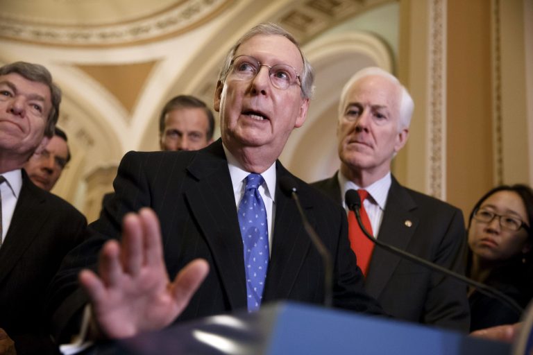 Senate Minority Leader Mitch McConnell, R-Ky., center, accompanied by fellow GOP lawmakers, speaks to reporters on Capitol Hill in Washington, Tuesday, March 25, 2014, following a GOP caucus lunch. From left are, Sen. Roy Blunt, R-Mo., Sen. John Thune, R-S.D., and McConnell and Senate Minority Whip John Cornyn of Texas. Relenting to GOP objections, Democrats have decided to remove a major roadblock preventing Congress from passing legislation authorizing sanctions on Russia and providing aid to Ukraine.  (AP Photo/J. Scott Applewhite)