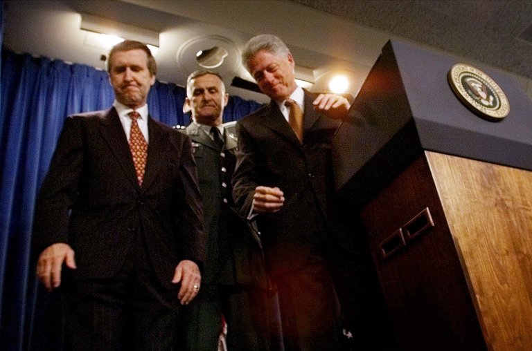 President Clinton walks away from the podium with Secretary of Defense William Cohen and Chairman of the Joint Chiefs of Staff Gen. Hugh Shelton in the briefing room of the White House Thursday, June 10,1999. (AP Photo/Doug Mills)