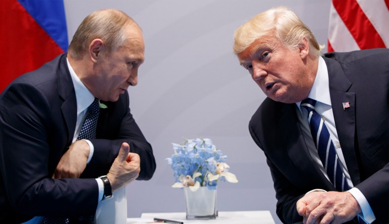 President Trump merely returned after a dinner with heads of state to his wife's seat, which Germany had placed next to Russian President Vladimir Putin's, the White House said.