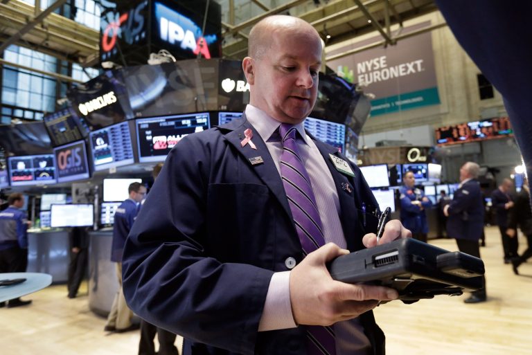 FILE - Trader Patrick Casey works on the floor of the New York Stock Exchange, in this April 7, 2014 file photo. Global stock markets were lower Friday April 11, 2014 as investors marked down technology stocks and a drop in U.S. jobless claims failed to boost investor confidence. (AP Photo/Richard Drew, File)