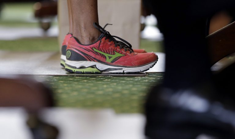 Sen. Wendy Davis, wears pink shoes as she filibusters in an effort to kill an abortion bill, June 2013, in Austin, Texas. (AP Photo/Eric Gay)