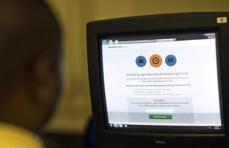 The online application of Reginald Wright stalls as he attempts to sign up for health care insurance on healthcare.gov at the Atlanta Medical Center South Campus, Monday, March 31, 2014, in Atlanta (AP Photo/David Goldman)
