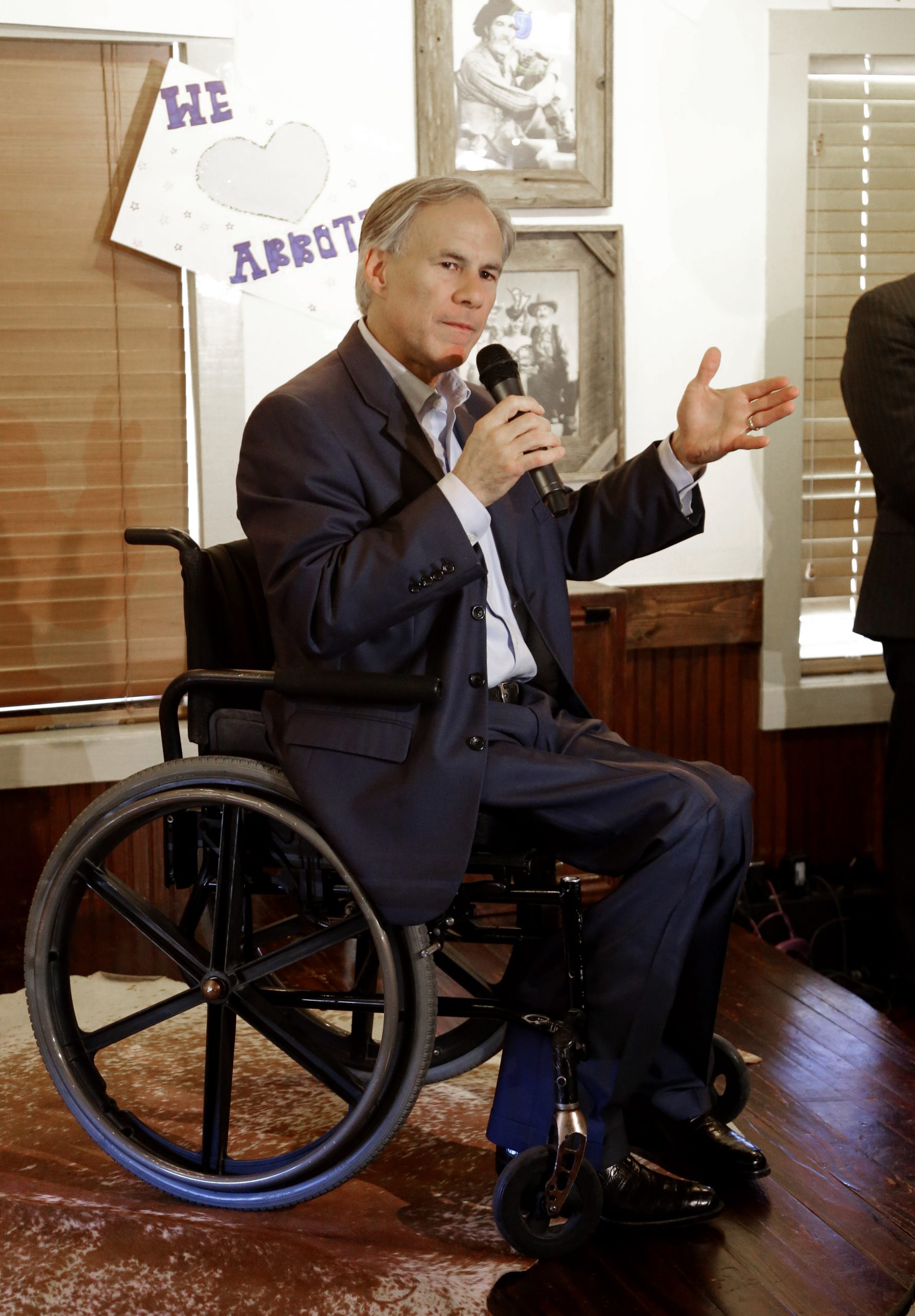 Abbott says wheelchair ad shows Davis is desperate