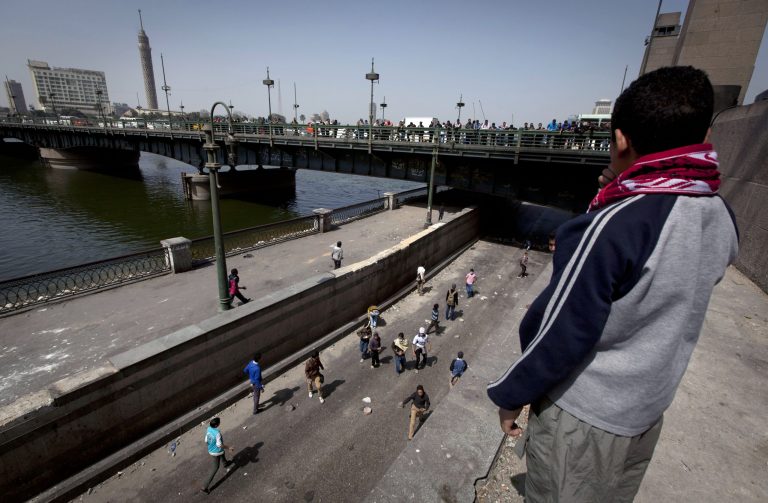 Egyptian protesters close the main street by the Nile river in downtown Cairo, Egypt, Sunday, March 10, 2013. Hundreds of police officers went on strike in recent days but Egypt's embattled interior minister, Mohammed Ibrahim, said on Sunday that he will not allow vigilante groups to fill in for his force, which has been strained by daily protests, violent clashes and harsh criticism from the media. (AP Photo/Nasser Nasser)