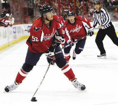 Ann Heisenfelt/AP
Mike Green didn't play Saturday and missed practice Monday after taking a hit to his left leg during Friday's win over the Devils.