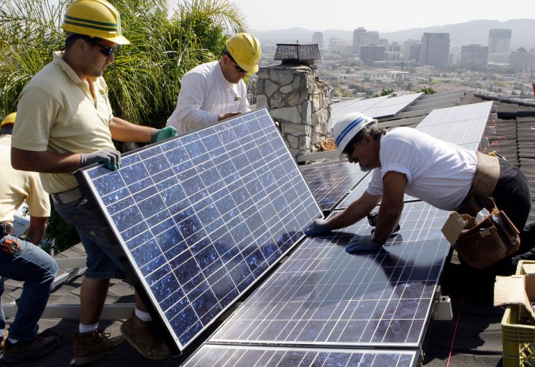 Sens. Lisa Murkowski and Jeff Flake said they suspected that the foot-dragging was the result of a lack of cooperation by agencies involved in the solar tax programs. (AP Photo/Reed Saxon)