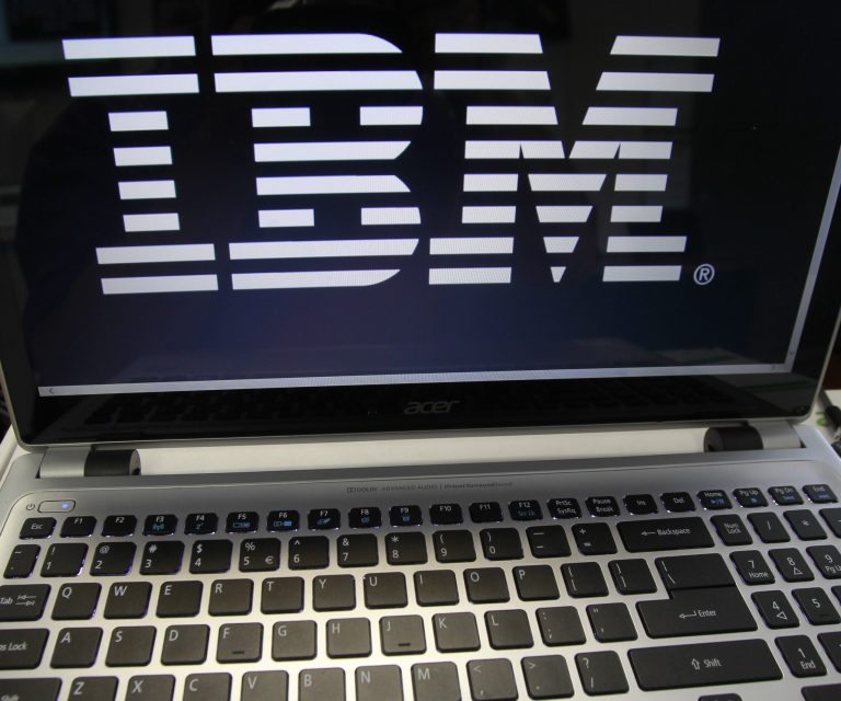 FILE - In this Tuesday, July 16, 2013, file photo, an IBM logo is displayed in Berlin, Vt. IBM is paying $1.5 billion to Globalfoundries in order to shed its costly chip division. IBM will make payments to the chipmaker over three years, but it will take a $4.7 billion charge in the third quarter when it reports results, Monday, Oct. 20, 2014. (AP Photo/Toby Talbot, File)