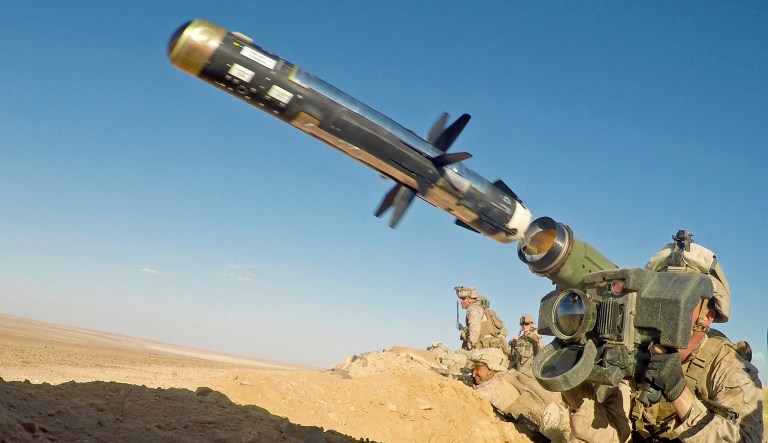 A U.S. Marine fires a FGM-148 Javelin, a shoulder-fired anti-tank missile, during a demonstration near At Tanf Garrison, Syria.
