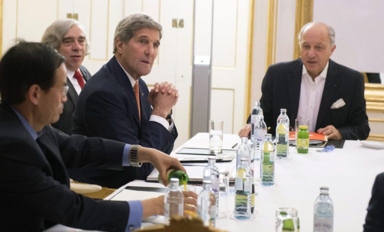 US Secretary of State John Kerry, second right, US Secretary of Energy Ernest Moniz, second left, and French Foreign Minister Laurent Fabius, right, meet at Palais Coburg Hotel, where the Iran nuclear talks are being held, in Vienna, Austria, Tuesday, July 14, 2015. After 18 days of intense and often fractious negotiation, diplomats Tuesday declared that world powers and Iran had struck a landmark deal to curb Iran's nuclear program in exchange for billions of dollars in relief from international sanctions. (Joe Klamar/Pool Photo via AP)