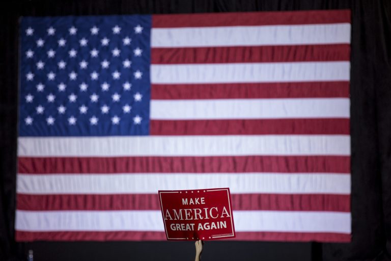 A member of a crowd holds a sign thousands of people attend a rally by President-elect Donald Trump in Orlando, Fla., Friday, Dec. 16, 2016. (AP Photo/Willie J. Allen Jr.)