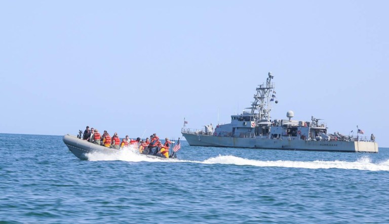 ARABIAN GULF (Feb. 10, 2019) Sailors ride past the Cyclone-class coastal patrol ship USS Hurricane (PC 3) in a rigid-hull inflatable boat during small boat operations.