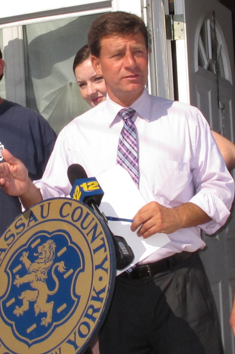 In this Oct. 2, 2013 photo, David Denenberg meets with Superstorm Sandy victims in Seaford, N.Y. Denenberg, a candidate for the New York Senate, has announced he is withdrawing from the race amid allegations from his former law firm that he created at least $2 million in fictitious client bills. The law firm Davidoff Hutcher & Citron filed a lawsuit against Denenberg Tuesday, Sept. 23, 2014, in state Supreme Court in Manhattan. Denenberg has been a Nassau County legislator since 1999. (AP Photo/Frank Eltman)