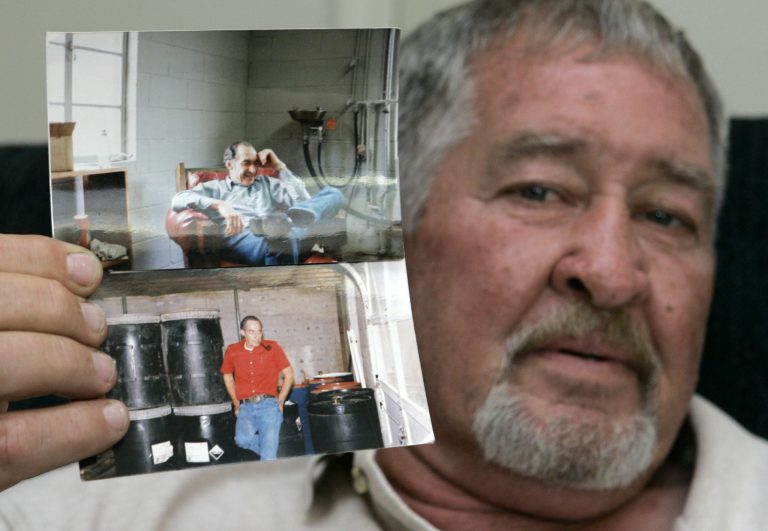   FILE - In this Tuesday, June 10, 2008 file photo, Al Gentry holds photos of his brother, who was murdered more than 20 years ago, at his home in Rockwell, N.C. For Al Gentry, timeâs running out to find his brotherâs killer. After years of chasing leads, he thought heâd found the person responsible for the 1986 murder - an elderly Georgia widow who was married to his brother and left a decades-long trail of five dead husbands in five states. Betty Neumar was charged in 2008 with three counts of solicitation to commit first-degree murder in the death of Harold Gentry. (AP Photo/Chuck Burton)  