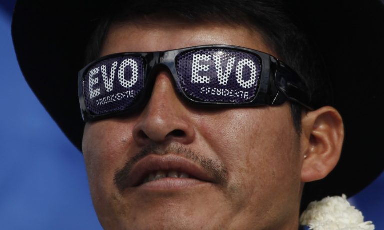 A supporter of Bolivia's President Evo Morales, who is running for re-election with the Movement Toward Socialism, MAS, attends the closing campaign rally in El Alto, Bolivia, Wednesday, Oct. 8, 2014. Bolivia will hold general elections on Sunday. (AP Photo/Juan Karita)