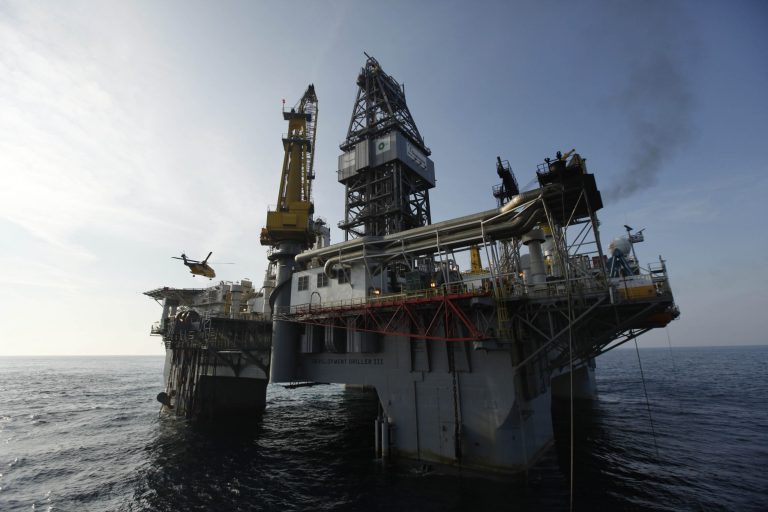 A helicopter takes off from the helipad of the Development Driller III, which is drilling the relief well at the site of the Deepwater Horizon oil spill May 11, 2010 off the coast of Louisiana in the Gulf of Mexico. (Photo by Gerald Herbert-pool/Getty images)
