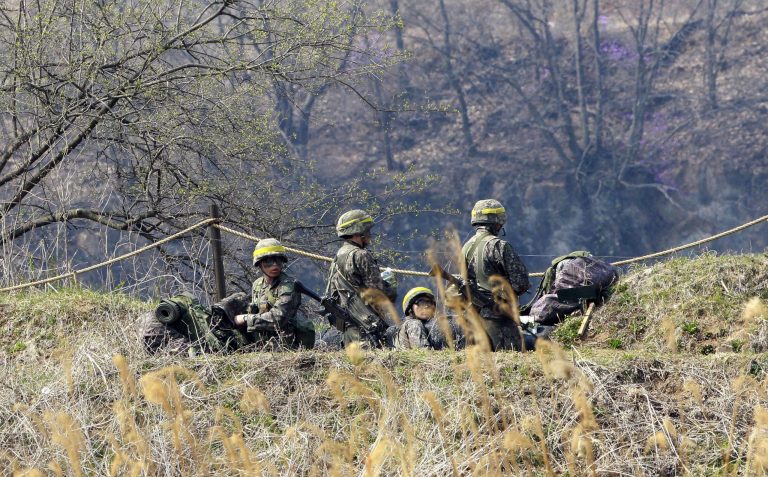 South Korean army soldiers take a position during an exercise in Yeoncheon, near the border with North Korea, on April 2. The two Koreas fired on Monday hundreds of artillery shells into each other's waters in a flare-up of animosity over a long-disputed sea boundary between the countries. (AP Photo/Ahn Young-joon)