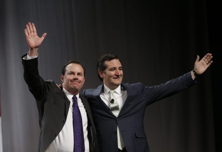 Sen. Mike Lee, R-Utah, left, and Sen. Ted Cruz, R-Texas, greet the audience during a rally at the Western Republican Leadership Conference Friday, April 25, 2014, in Sandy, Utah. Cruz, headlined the final day of a two-day conference in Utah where Republican party leaders from western states are meeting. (AP Photo/Rick Bowmer)