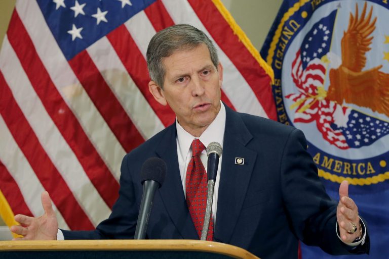 Acting Secretary of Veterans Affairs Sloan Gibson speaks, Thursday, June 5, 2014, in Phoenix. It was Acting Secretary Gibson's first visit to Phoenix since taking over the agency amid an investigation that found 1,700 veterans were kept off the official waiting list for care at the troubled Arizona hospital. (AP Photo/Matt York)