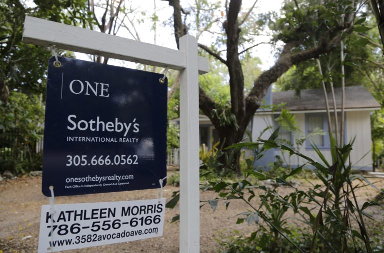 FILE - This Monday, May 19, 2014, file photo, shows a home for sale in the Coconut Grove neighborhood of Miami. U.S. home prices rose in April compared with a year earlier, but the increase was the smallest annual gain in 14 months. Price gains have slowed this year as sales have faltered. (AP Photo/Lynne Sladky, File)