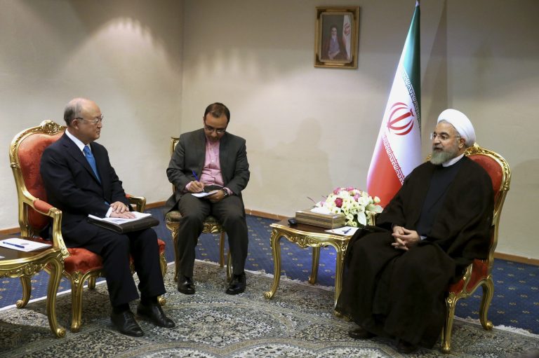 Iran's President Hassan Rouhani, right, speaks with the International Atomic Energy Agency's director-general, Yukiya Amano, at the start of their meeting in Tehran, Iran, Thursday, July 2, 2015. The head of the U.N. atomic agency, Amano, visited Tehran to discuss remaining outstanding issues over Iran's nuclear program. (AP Photo/Ebrahim Noroozi)