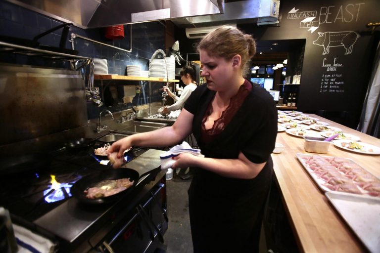   FILE - In this Sept. 27, 2013 file photo,Sous Chef Maya Lovelace prepares quail at Beast Restaurant in Portland, Ore. The Institute for Supply Management issues its U.S. non-manufacturing (service-sector) index for September on Thursday, Oct. 3, 2013. (AP Photo/Don Ryan, File)  