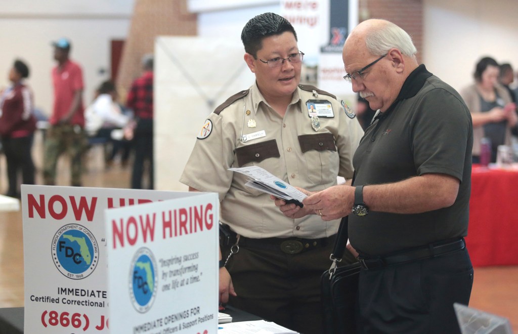 Jobless claims hover at ultra-low 239,000