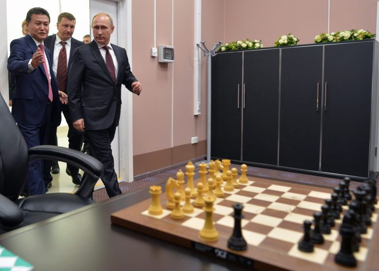 Russian President Vladimir Putin,  right, and FIDE president Kirsan Ilyumzhinov, left, walk after an award ceremony of the FIDE World Chess Championship Match in Sochi, Russia, Tuesday, Nov. 25, 2014. Norway's Magnus Carlsen won against India's former World Champion Vishwanathan Anand. (AP Photo/RIA-Novosti, Alexei Druzhinin, Presidential Press Service)