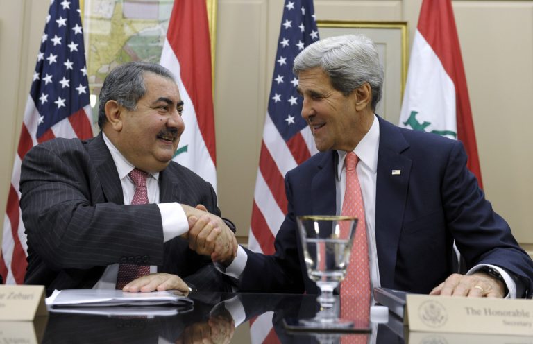   Secretary of State John Kerry shakes hands with Iraqi Foreign Minister Hoshyar Zebari at the State Department in Washington, Thursday, Aug. 15, 2013. Kerry met Thursday with the foreign minister, and said that since he visited Baghdad in March, some progress has been made to stop Iraq from being a transit zone for weapons. But he says 