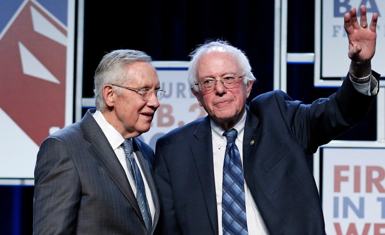 Senate Minority Leader Harry Reid, D-Nev., left, said that Vermont Sen. Bernie Sanders should learn sooner rather than later that it's time to 