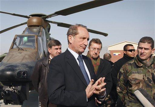 France's President Nicolas Sarkozy delivers a speech to present his New Year wishes to the foreign diplomatic corps at the Elysee Palace in Paris on Friday. France is suspending its training operations in Afghanistan and threatening to withdraw its entire force from the country early, after an Afghan soldier shot and killed four French troops Friday and wounded several others. 
