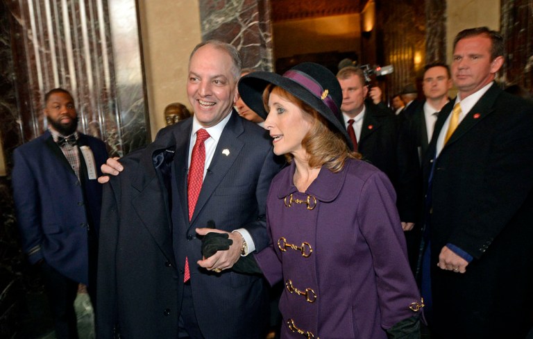 John Bel Edwards and his wife Donna, right, are all smiles while walking into Memorial Hall in the State Capitol Monday, Jan. 11, 2016, before proceeding outside for the inauguration ceremonies in Baton Rouge, La. Edwards is Louisiana's 56th governor. (Bill Feig/Baton Rouge Advocate via AP, Pool)
