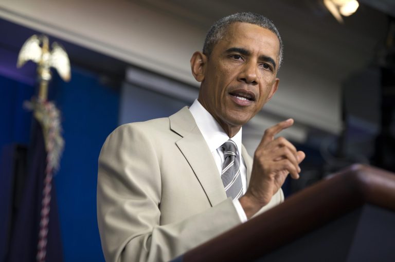 President Barack Obama gestures in the James Brady Press Briefing Room of the White House in Washington, Thursday, Aug. 28, 2014, where he spoke about the economy, Iraq, and Ukraine, before convening a meeting with his national security team on the militant threat in Syria and Iraq. (AP Photo/Evan Vucci)