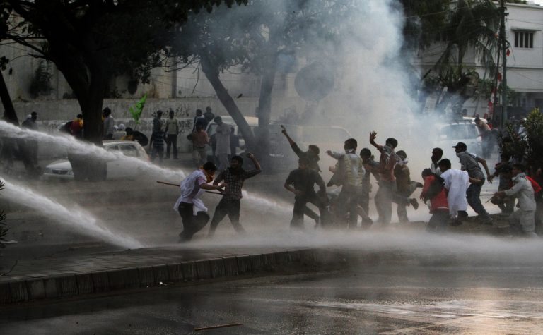 Pakistani police use a water cannon to disperse the protesters marching toward the U.S. consulate during a demonstration in Karachi, Pakistan, Sunday, Sept. 16, 2012. Hundreds of Pakistanis protesting an anti-Islam video produced in the United States clashed with police Sunday as they tried to march toward the U.S. Consulate in the southern city of Karachi, while thousands of others held peaceful demonstrations in other parts of the country. (AP Photo/Fareed Khan)