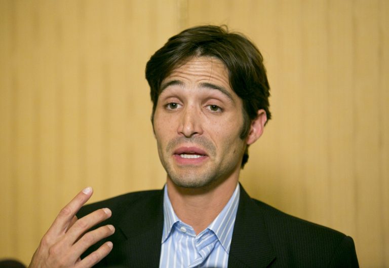 Plaintiff Michael Egan takes questions from to the media during a news conference in Beverly Hills, Calif., Thursday, April 17, 2014. (AP/Damian Dovarganes)