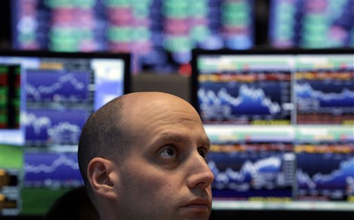 The Dow Jones industrial average, an index of 30 U.S. stocks and a gauge of financial markets, closed at a record high of 14,253 on Tuesday. (AP Photo/Richard Drew, File)