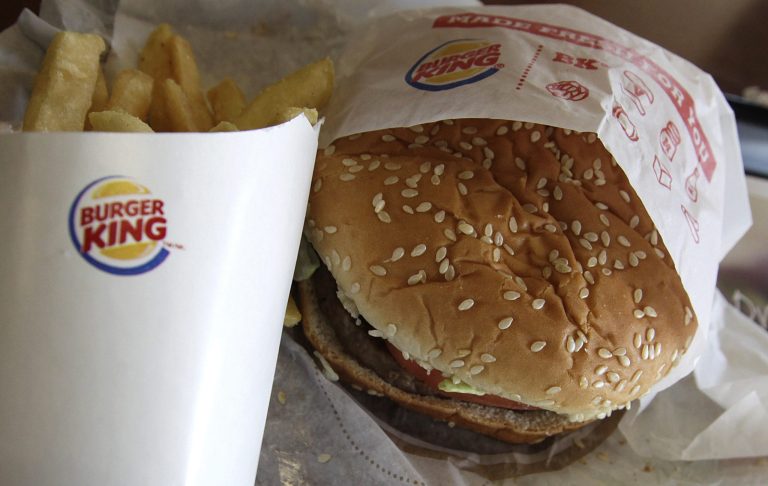 FILE - This Wednesday, June 20, 2012 file photo shows a burger and fries at a Burger King in Richardson, Texas. The Miami-based chain on Thursday, May 8, 2014 announced it is offering 