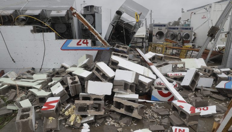 A coin laundry lost it's roof and portions of walls in the wake of Hurricane Harvey, Saturday, Aug. 26, 2017, in Rockport, Texas. (AP Photo/Eric Gay)