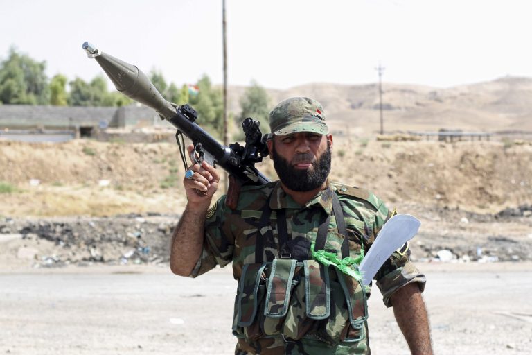 A Shiite militiaman stands guard Sunday in Amirli, where Iraqi security forces and Shiite militiamen broke a six-week siege imposed by ISIS. Sen. Mark Warner, D-Va., called ISIS 