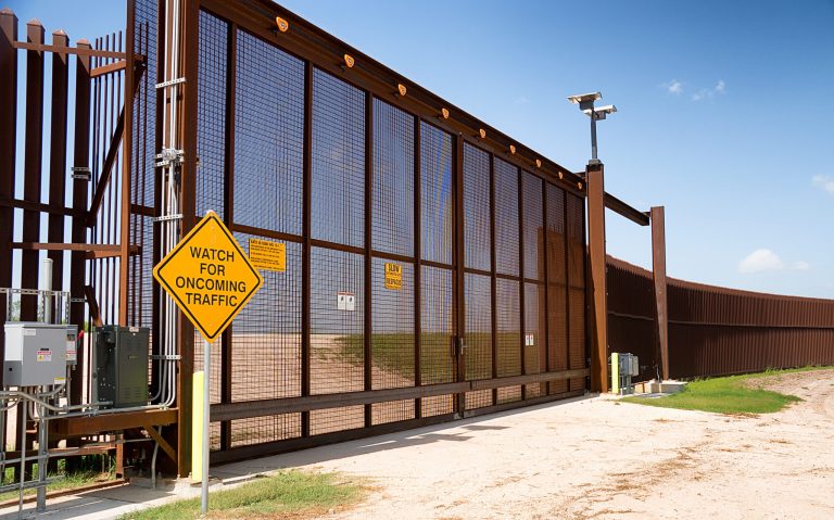 The fence marking the border between Mexico and the United States, in La Paloma, Texas.
