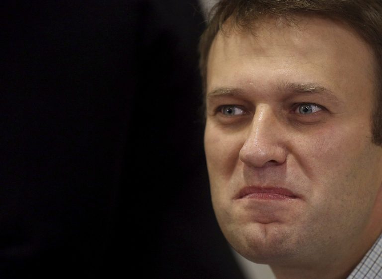 FILE In this Sunday, Oct. 27, 2013 file photo Russian opposition leader Alexei Navalny takes part at an opposition rally in downtown Moscow. Russiaâs top opposition leader and anti-corruption campaigner Alexei Navalny on Monday, Jan. 27, 2014, launched a website to publish a wide range of data pointing to corruption in Sochi.  Russia has spent about $51 billion to deliver the Winter Olympics in Sochi, which run Feb. 7-23. (AP Photo/ Ebgeny Feldman, file )