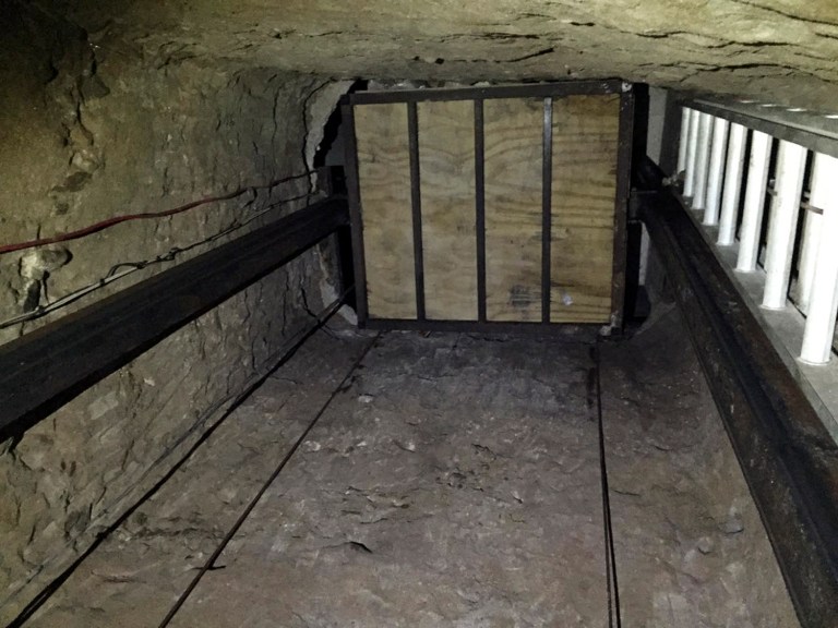 The tunnel, which runs from a flophouse in Tijuana to a home in a San Diego suburb, is about 2,600 feet — or roughly nine football fields long. According to Laura Duffy, U.S. attorney for the Southern District of California, the three-foot wide tunnel was equipped with lights, ventilation, a rail system and a motorized freight elevator that could carry up to 10 people. (United States Department of Justice via AP)
