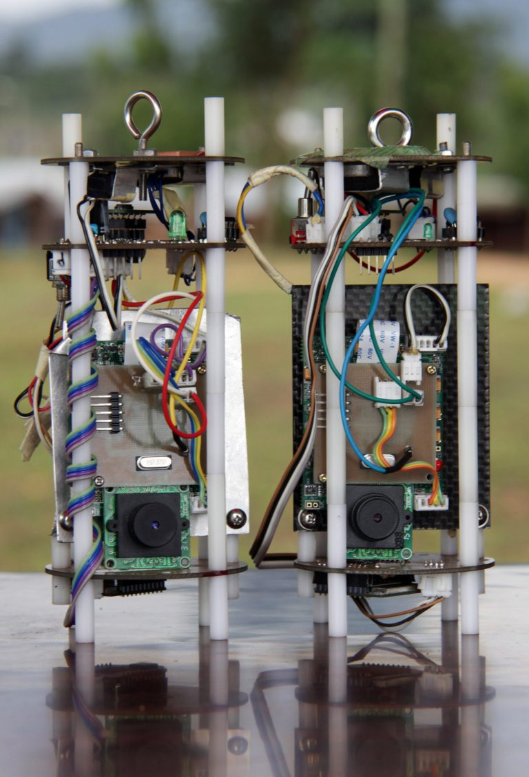 In this Tuesday, May 14, 2013 photo, students prepare a Coke-can sized satellite for a test launch the following day, at All Nations University in Koforidua, Ghana. Ghanaian college students plan Wednesday to launch a model of a satellite the size of a Coke can 200 yards (meters) into the air. Organizers hope that it will be the start of this West African country's space program.(AP Photo/Christian Thompson)