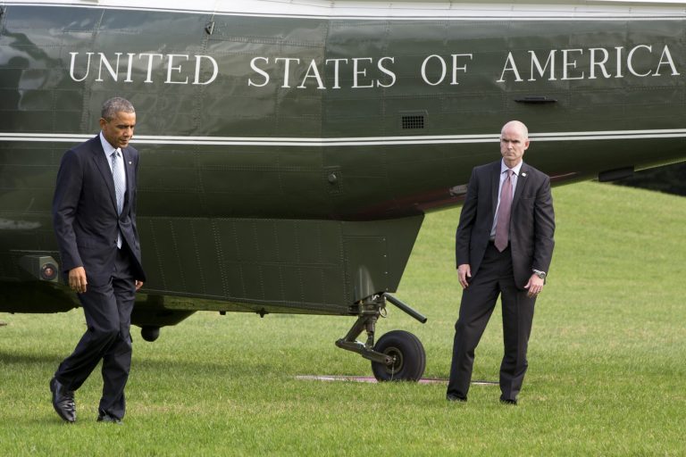 President Barack Obama walks from Marine One on the South Lawn of the White House in Washington, Tuesday, Oct. 14, 2014, upon his return from a meeting at Andrews Air Force Base, Md. The president met with military chiefs in a show of strength against Islamic State fighters in Iraq and Syria. (AP Photo/Jacquelyn Martin)