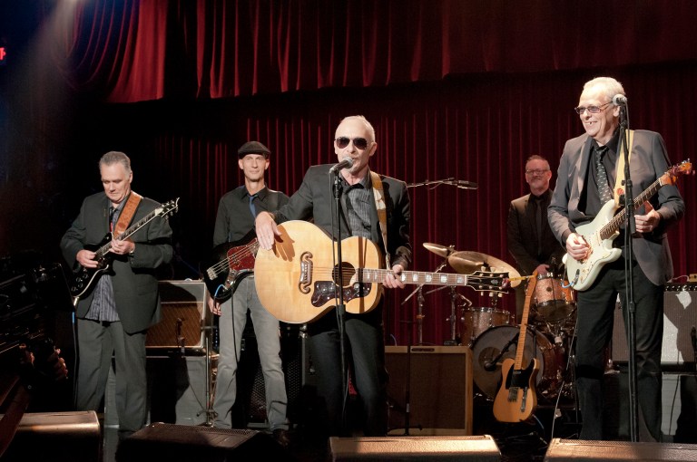   This undated publicity film image released by Universal Pictures shows Graham Parker, center, in a scene from the Universal Pictures film, 