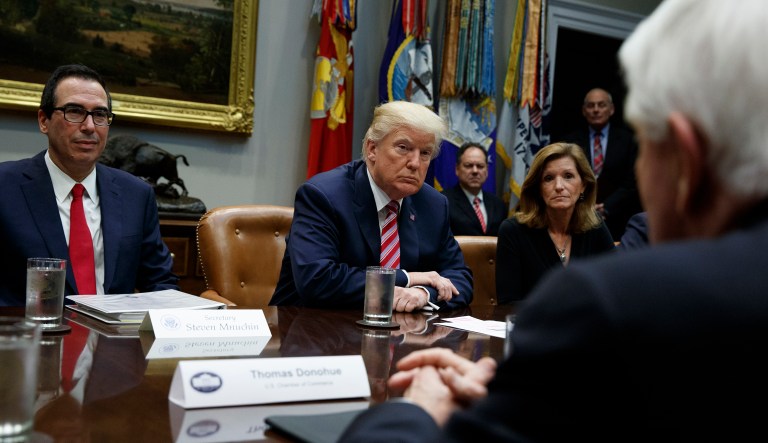 President Donald Trump listens during a meeting on tax policy with business leaders in the Roosevelt Room of the White House, Tuesday, Oct. 31, 2017, in Washington. From left, Treasury Secretary Steve Mnuchin, Trump, Karen Kerrigan, President and CEO, Small Business & Entrepreneurship Council, and Tom Donohue, President and CEO, U.S. Chamber of Commerce, foreground. (AP Photo/Evan Vucci)