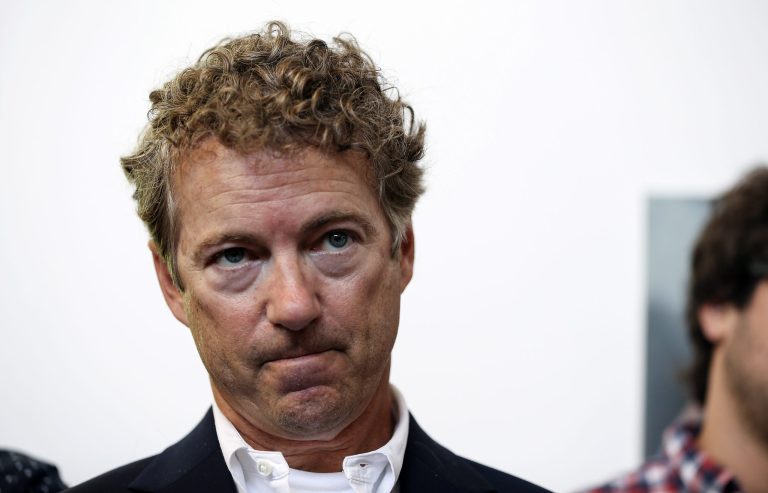 Republican presidential candidate Sen. Rand Paul, R-Ky., listens as he is introduced at a Town Hall meeting at the Kilton Library in West Lebanon, N.H.. Saturday, July 25, 2015. (AP Photo/Cheryl Senter)