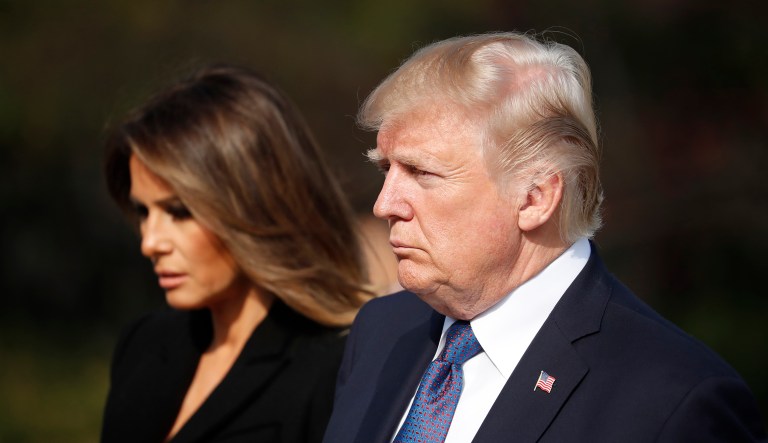 A new book by Michael Wolff says that on election night, Melania Trump (pictured left) was in tears when the numbers tilted in favor of her husband, then-candidate Donald Trump (pictured right). (Kim Hong-Ji/Pool Photo via AP)
